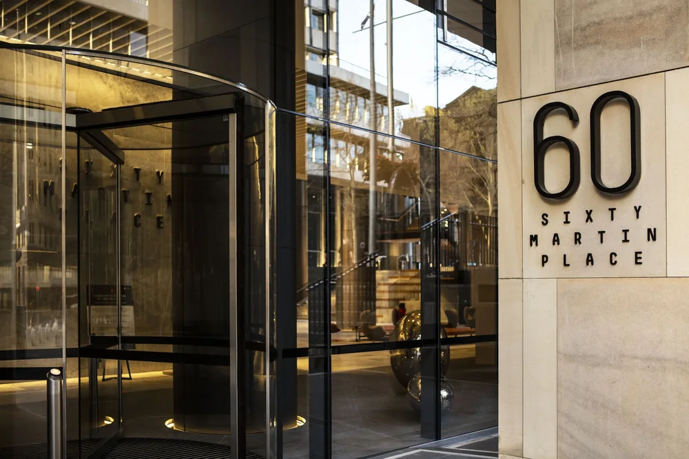 Entrance of 60 Martin Place, Sydney, with the building name on the sandstone facade